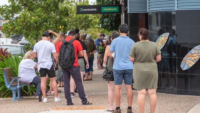Brisbane, Australia. 24th Mar, 2020. Australians queue at Centrelink during covid-19 pandemic.Covid-19 pandemic hits Australian capital cities. Sports, music events are cancelled or postponed and school, universities and business follow government guideli