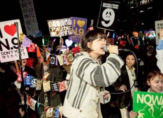 Protests as Japan boosts military to back the US against China