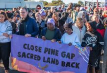 Hundreds descend on Pine Gap to expose base’s role in genocide